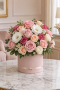 Pink and white congratulations flowers in a dusty blush box