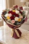 Red ivory blush and gold rose bouquet in burgundy and sand beige wrapping